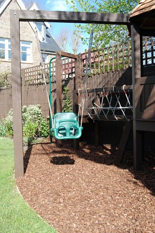 Playframe with rope bridge, play house, monkey bars, swing, fireman's pole 4