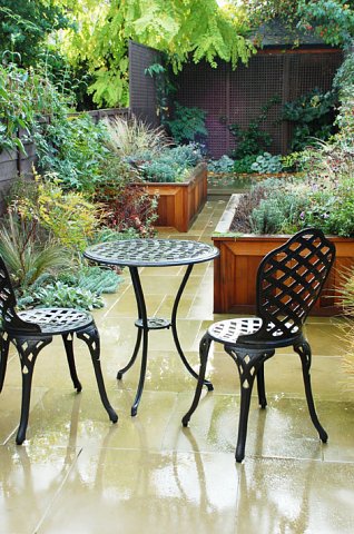 Yorkstone paving and cedar planters